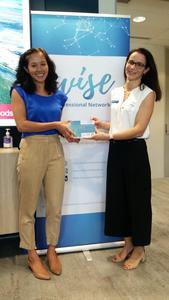 Sophie Yin receiving the Wise Recognition Certificate from the Committee Member Celine Lanoelle.